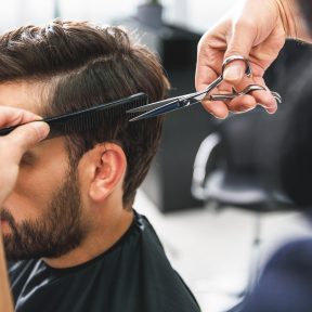 Barber,Using,Scissors,And,Comb